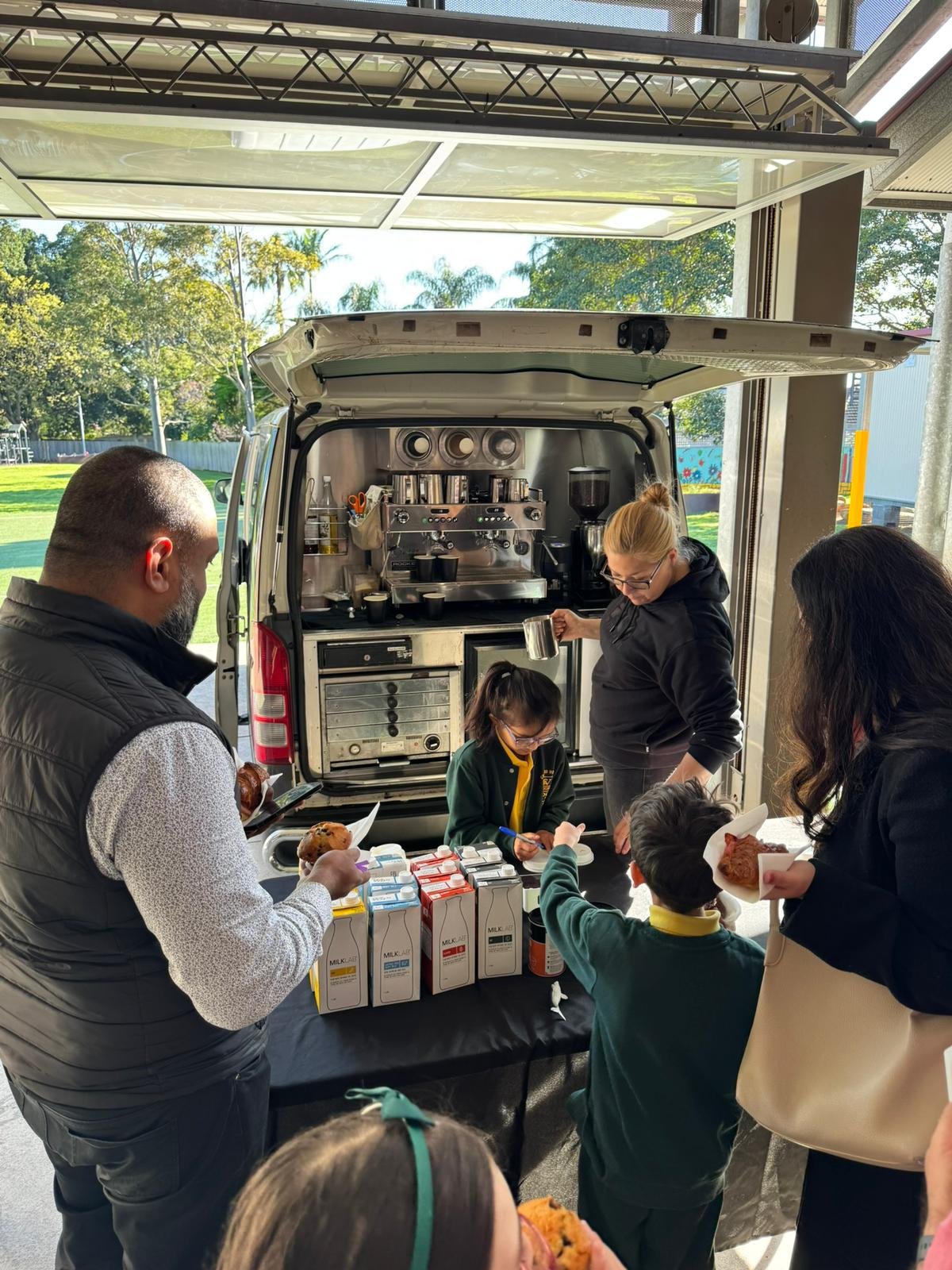 Madison Ave barista serving coffee alongside catering